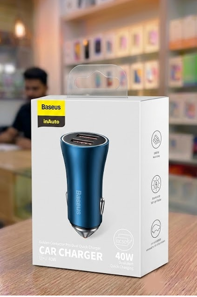 Baseus car charger packaging on a table with a blurred store background