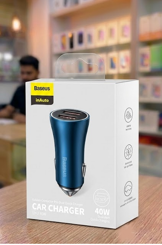 Baseus car charger packaging on a table with a blurred store background